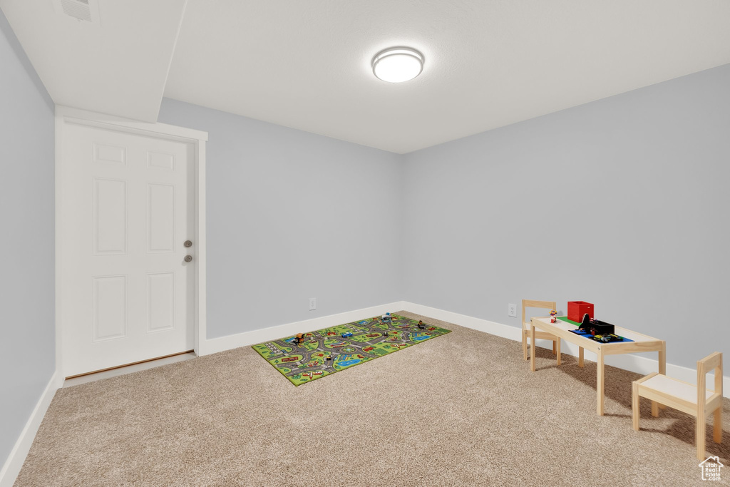 Playroom featuring carpet floors and baseboards