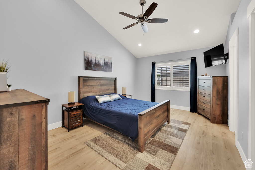 Bedroom with light wood-style floors, baseboards, recessed lighting, high vaulted ceiling, and a ceiling fan