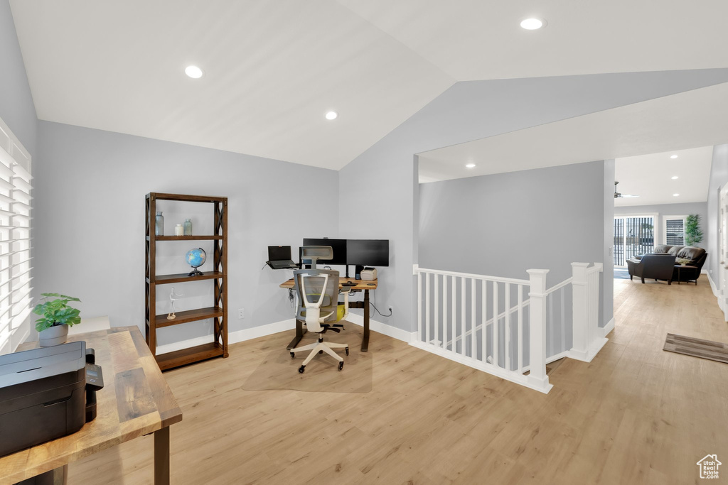Office featuring light wood-style flooring, lofted ceiling, recessed lighting, and baseboards