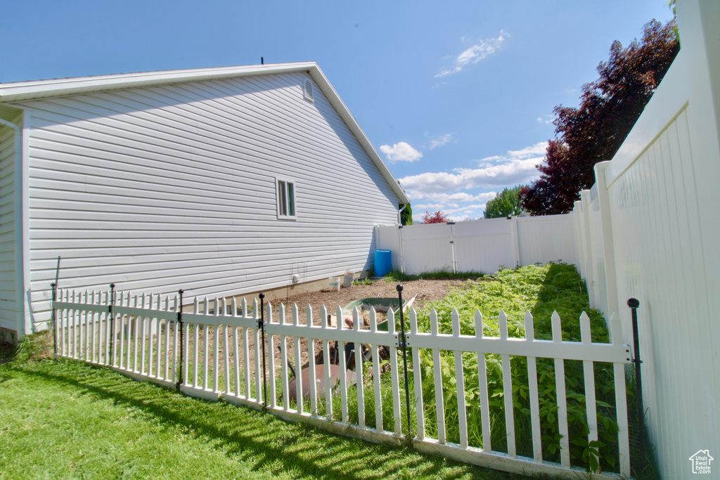 View of property exterior with a fenced backyard