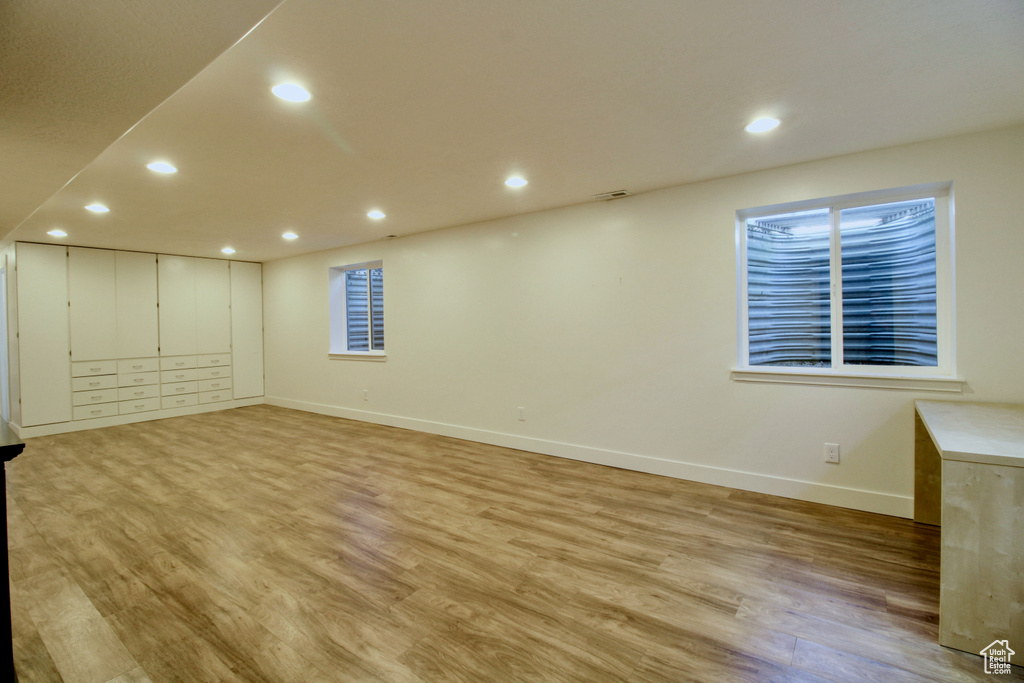 Unfurnished room featuring light wood-style flooring, baseboards, and recessed lighting