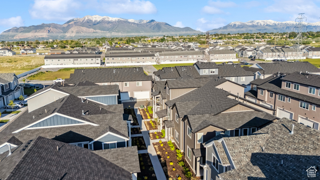 Aerial perspective of suburban area with a mountainous background