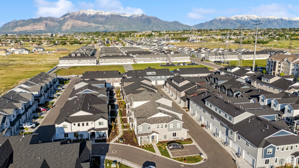 Aerial perspective of suburban area with a mountainous background