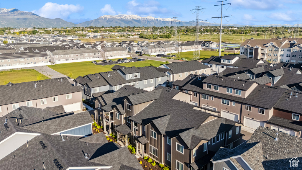 Aerial view of residential area featuring a mountain backdrop