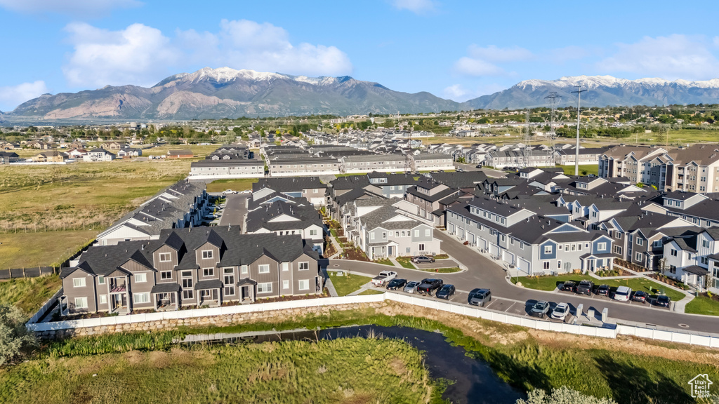 Aerial perspective of suburban area with a mountainous background