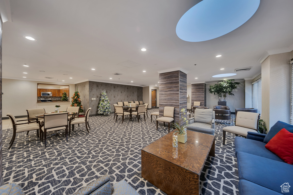 Building lobby with recessed lighting and crown molding