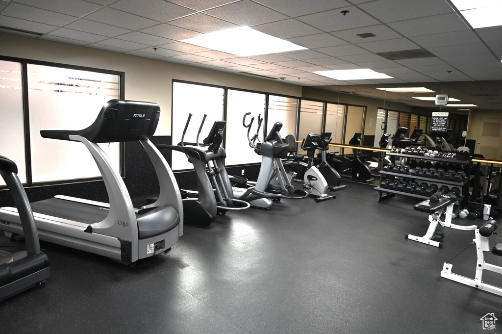 Workout area featuring a paneled ceiling