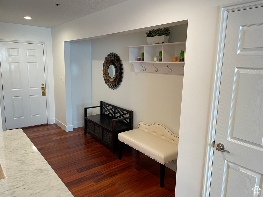Mudroom featuring dark wood-style flooring, recessed lighting, and baseboards