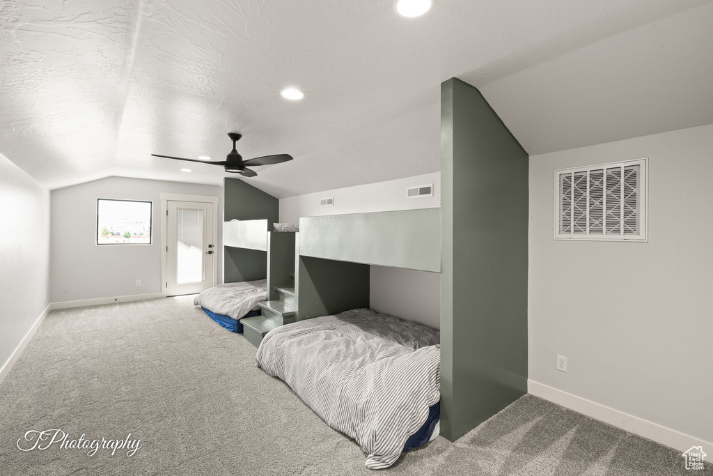 Carpeted bedroom with lofted ceiling, baseboards, recessed lighting, ceiling fan, and access to outside
