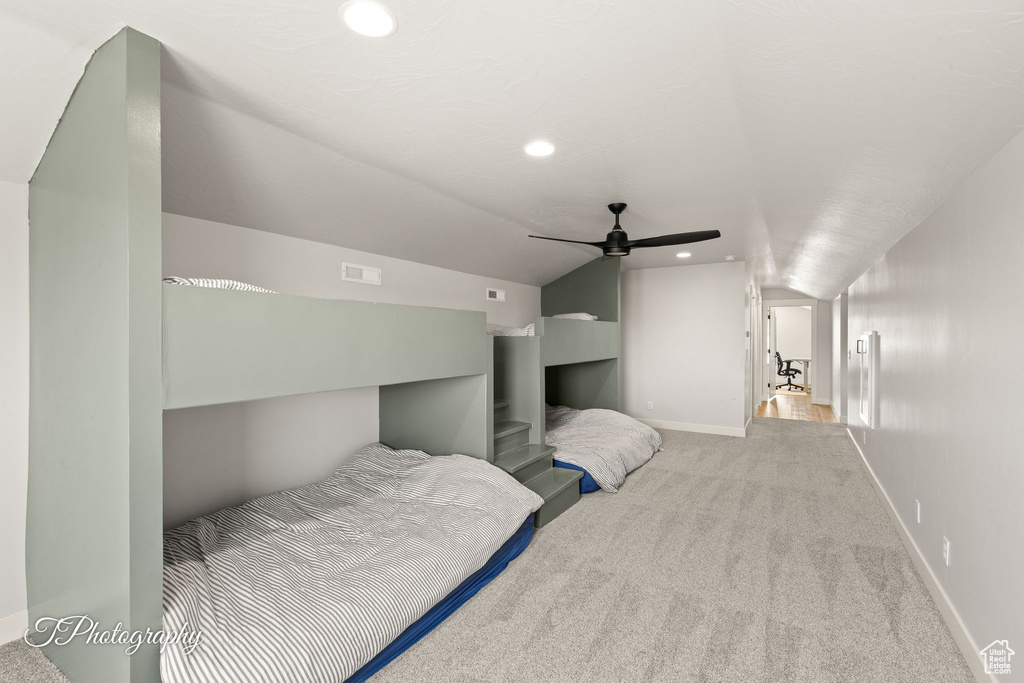 Bedroom featuring carpet, lofted ceiling, baseboards, recessed lighting, and ceiling fan