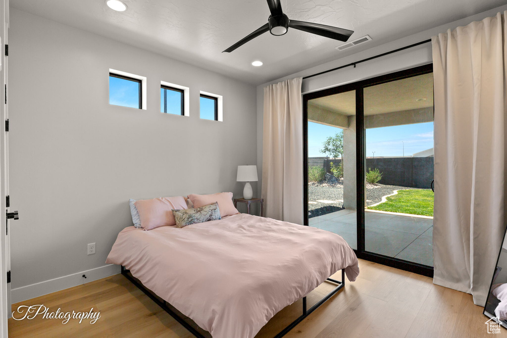 Bedroom with access to exterior, light wood-style flooring, recessed lighting, baseboards, and a ceiling fan