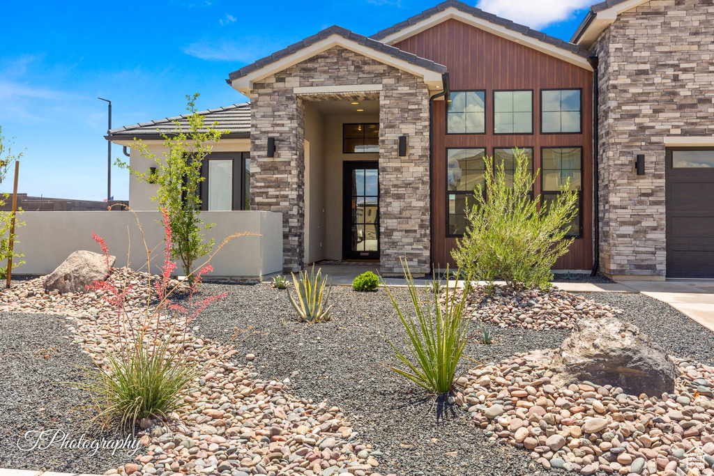 View of front of home featuring stone siding