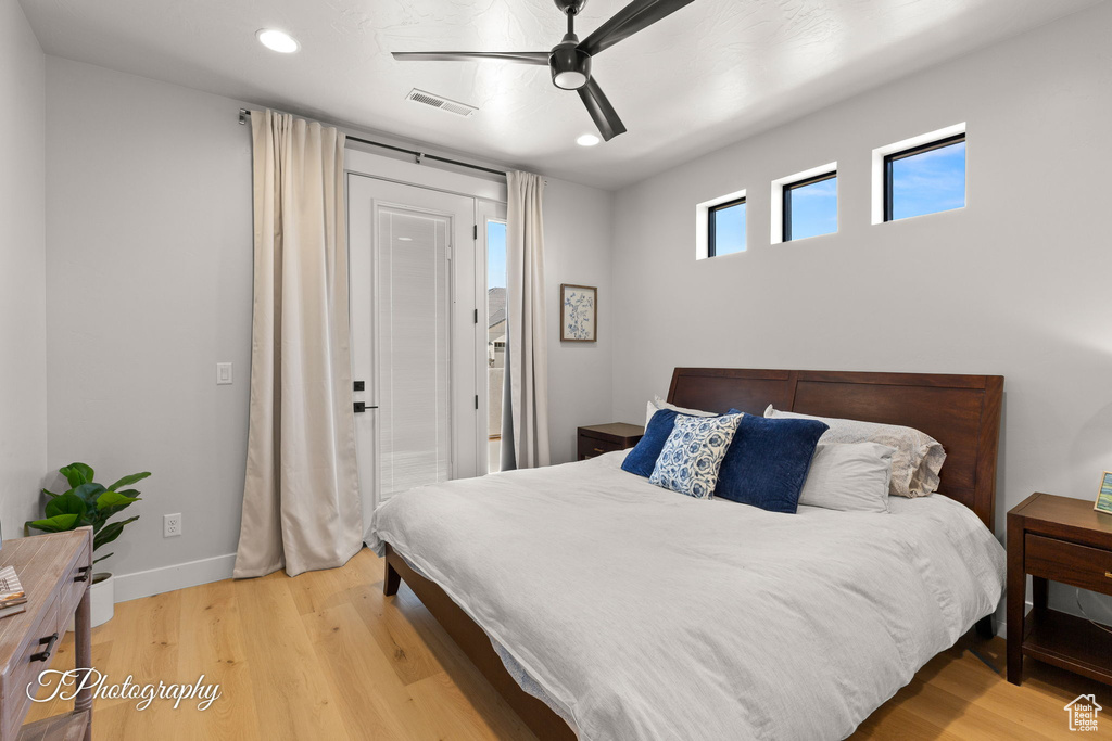 Bedroom with recessed lighting, wood finished floors, baseboards, and ceiling fan