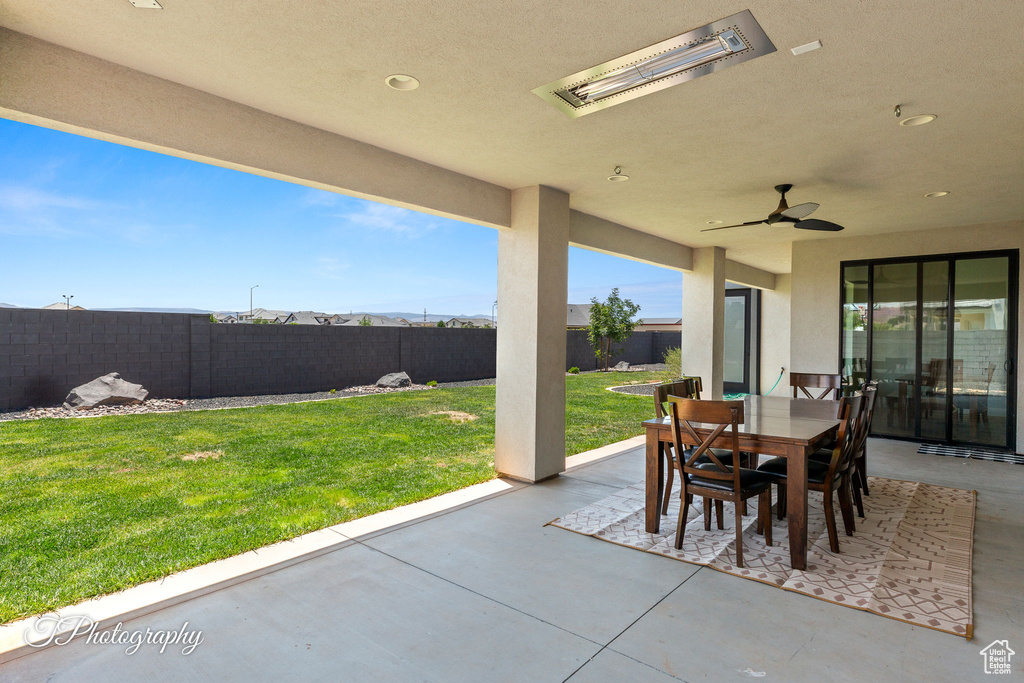 View of patio / terrace featuring outdoor dining area and a ceiling fan