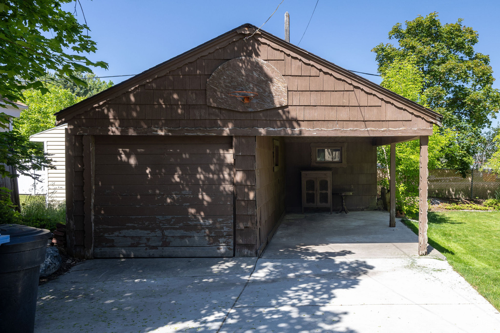 Garage with driveway and a detached garage