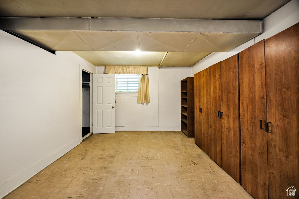 Basement featuring baseboards