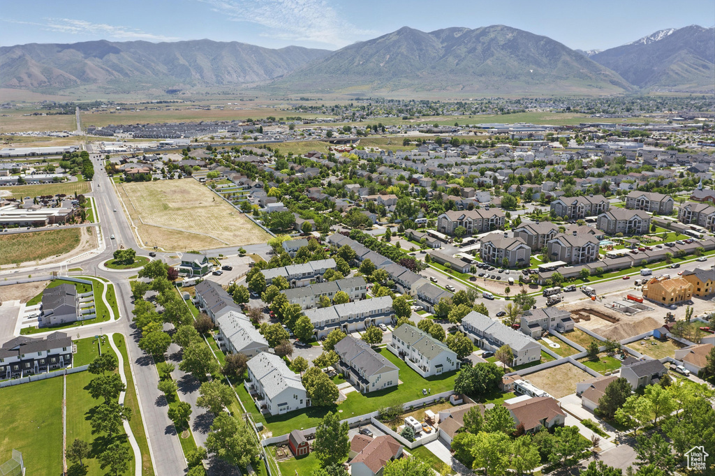 Aerial perspective of suburban area featuring a mountainous background