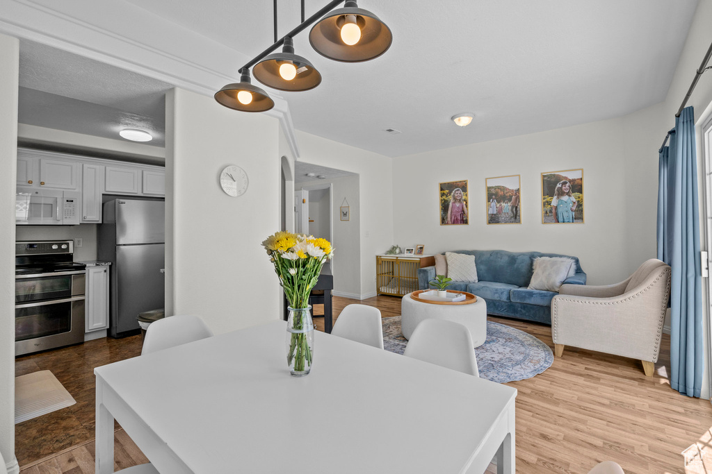 Dining area featuring light wood-type flooring