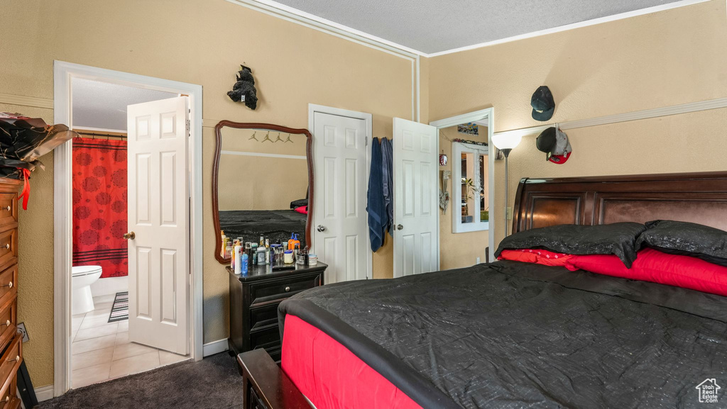 Bedroom with carpet and ornamental molding