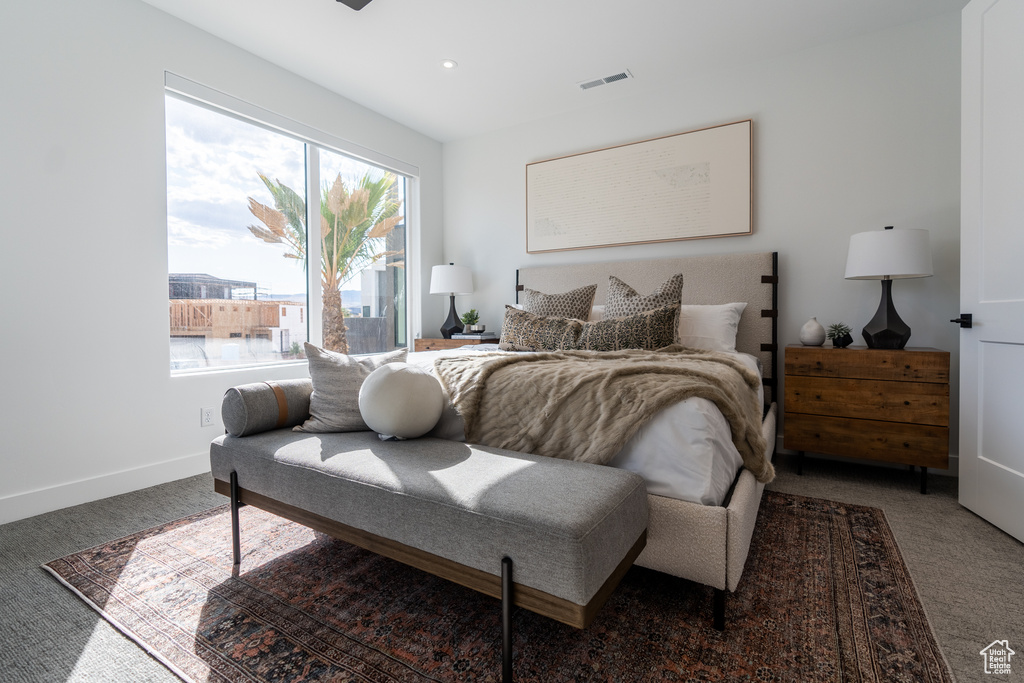 Carpeted bedroom with baseboards