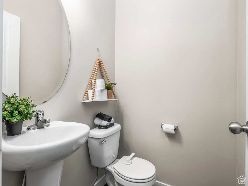 Bathroom featuring toilet and a sink