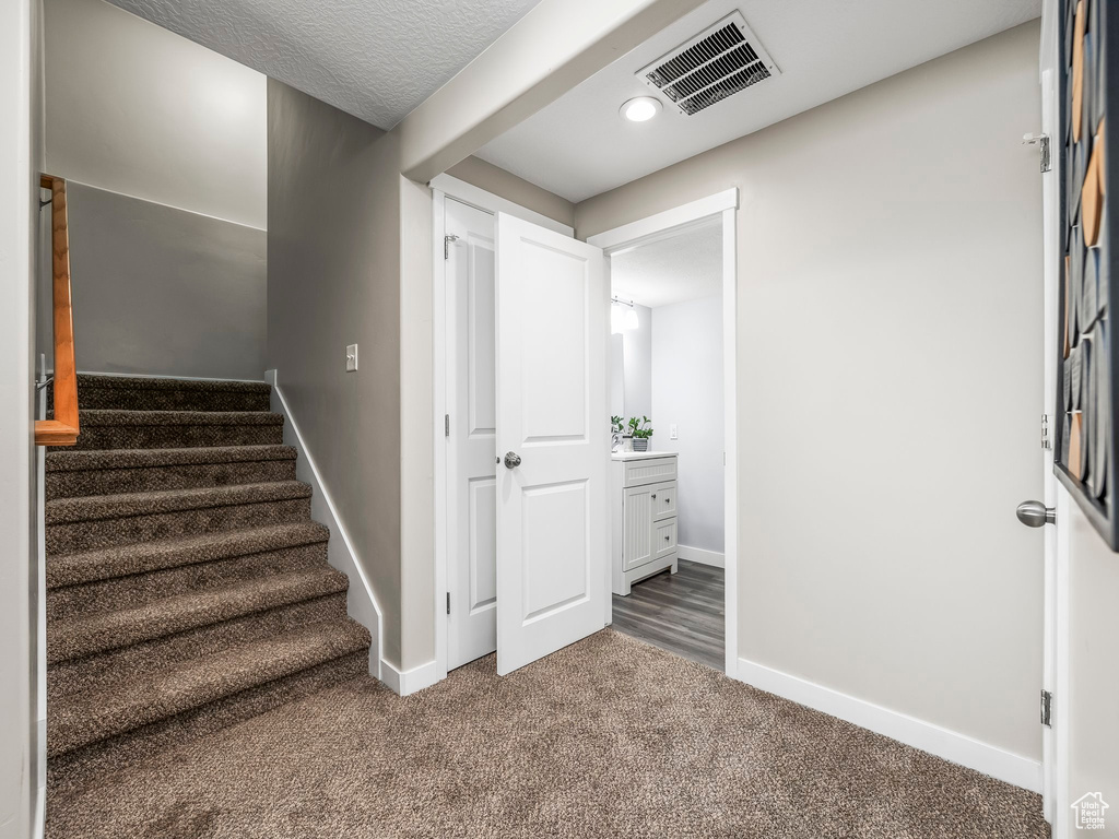 Stairway with carpet floors, baseboards, and recessed lighting