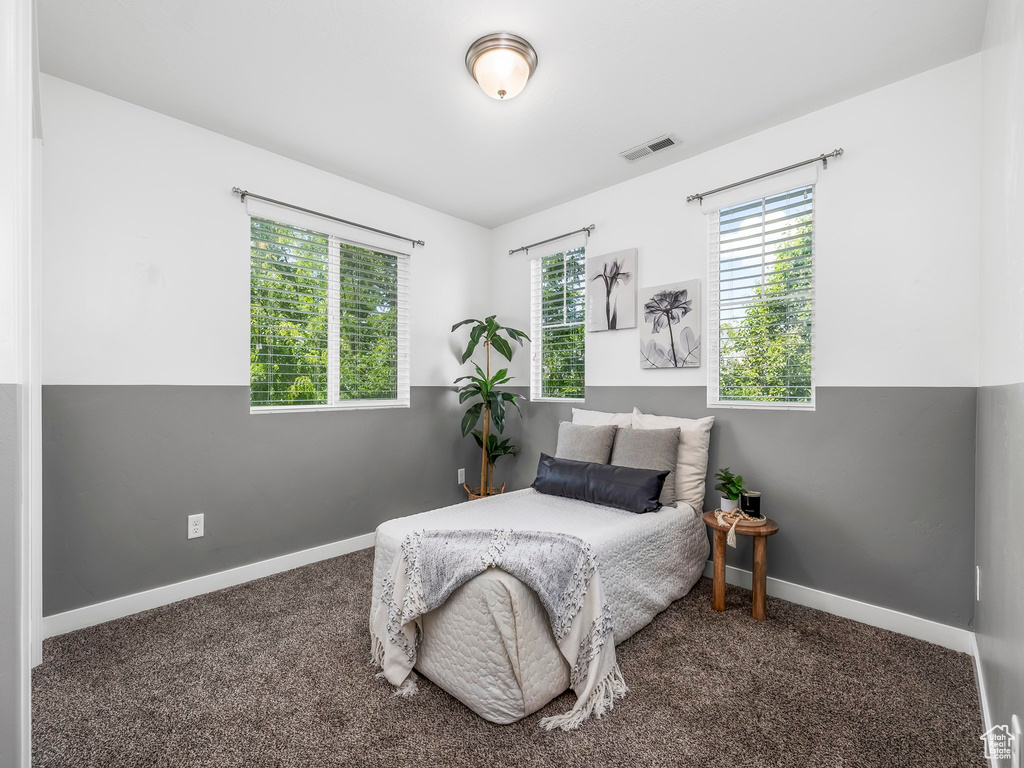 Bedroom with carpet and baseboards