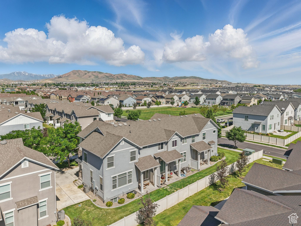 Aerial view of residential area with a mountainous background