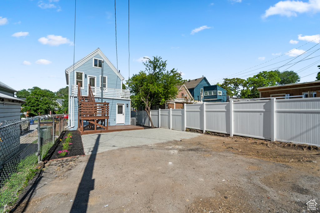 Rear view of house with stairs
