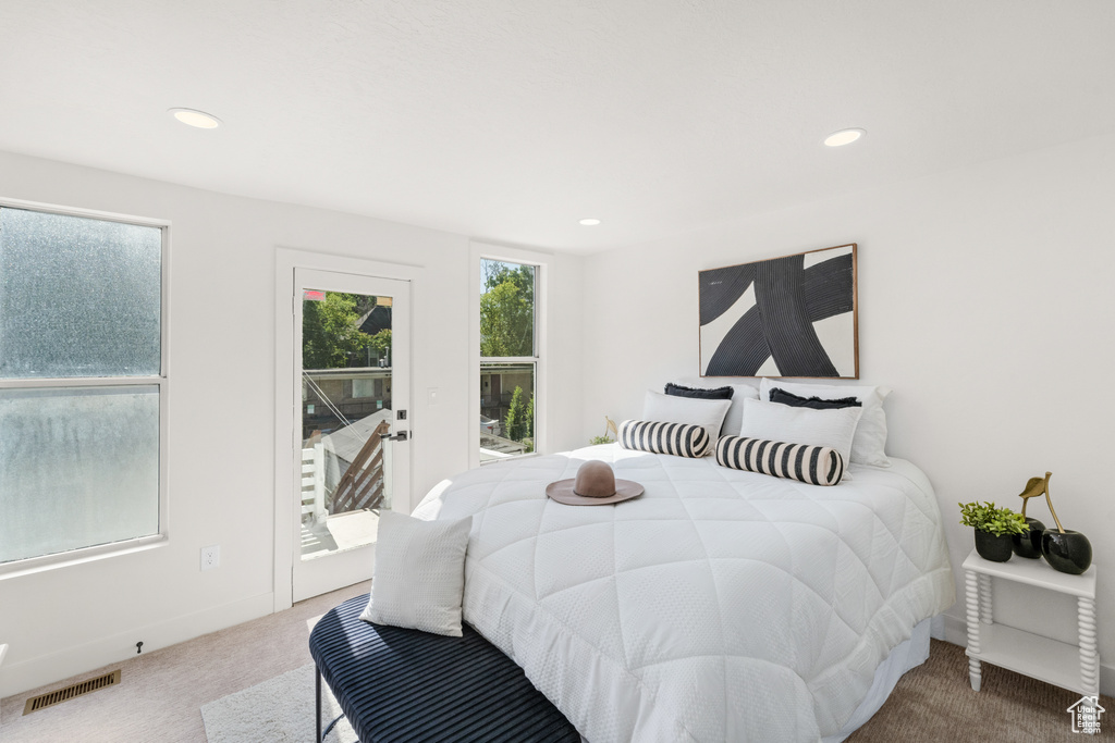 Carpeted bedroom with access to outside and recessed lighting