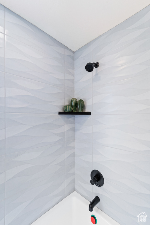 Full bath featuring bathing tub / shower combination