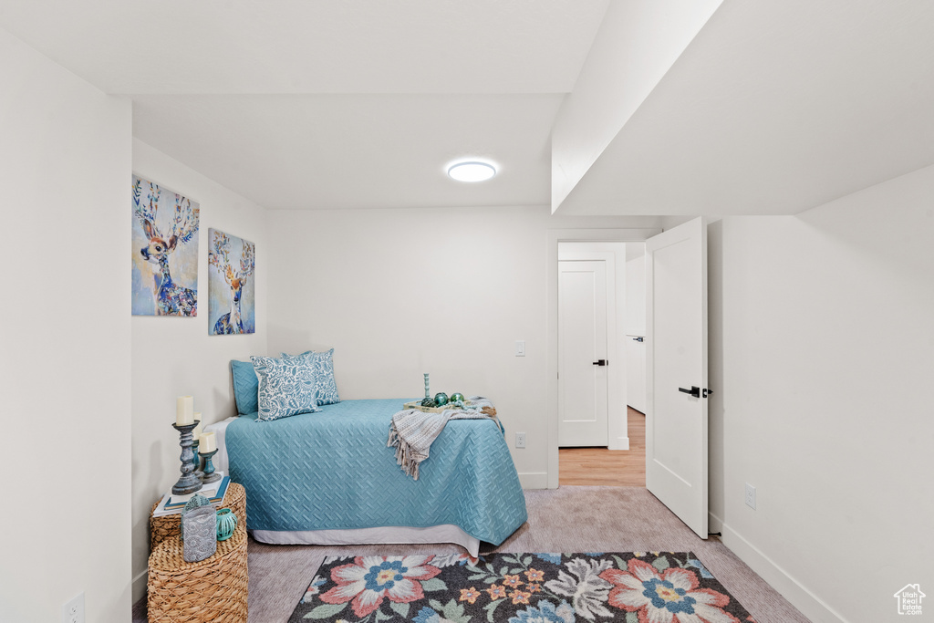 Carpeted bedroom featuring baseboards