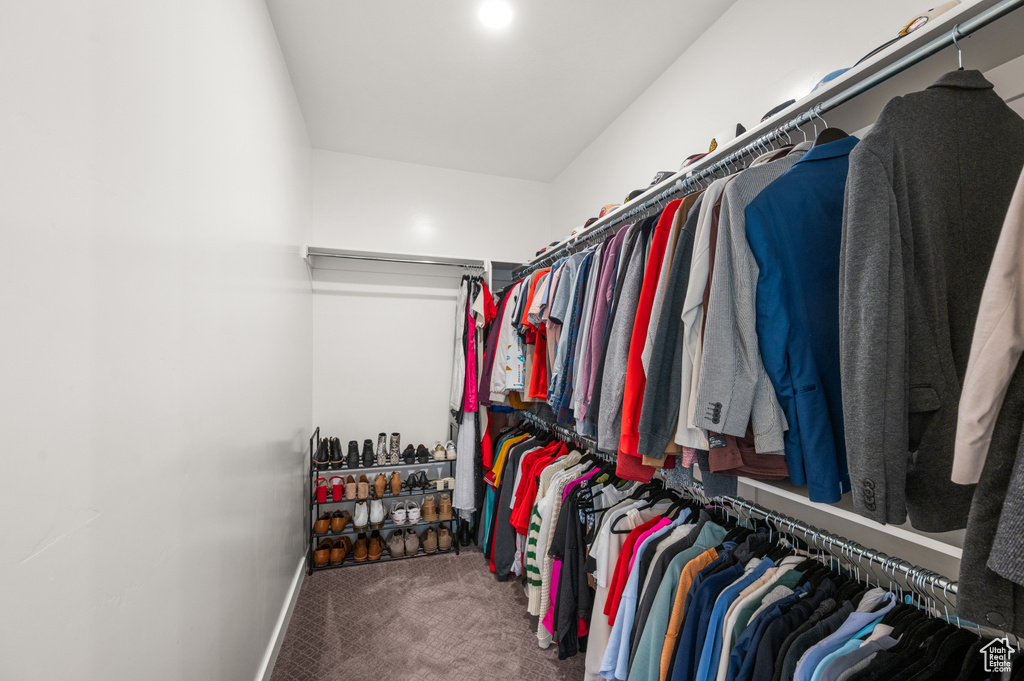 Walk in closet featuring carpet flooring