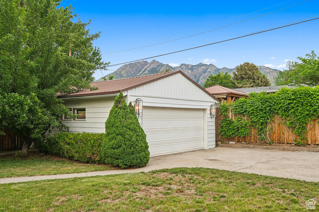 Garage featuring a mountain view