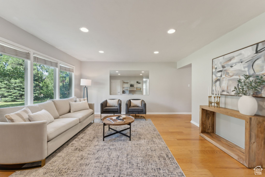 Living room featuring recessed lighting, light wood-type flooring, and baseboards