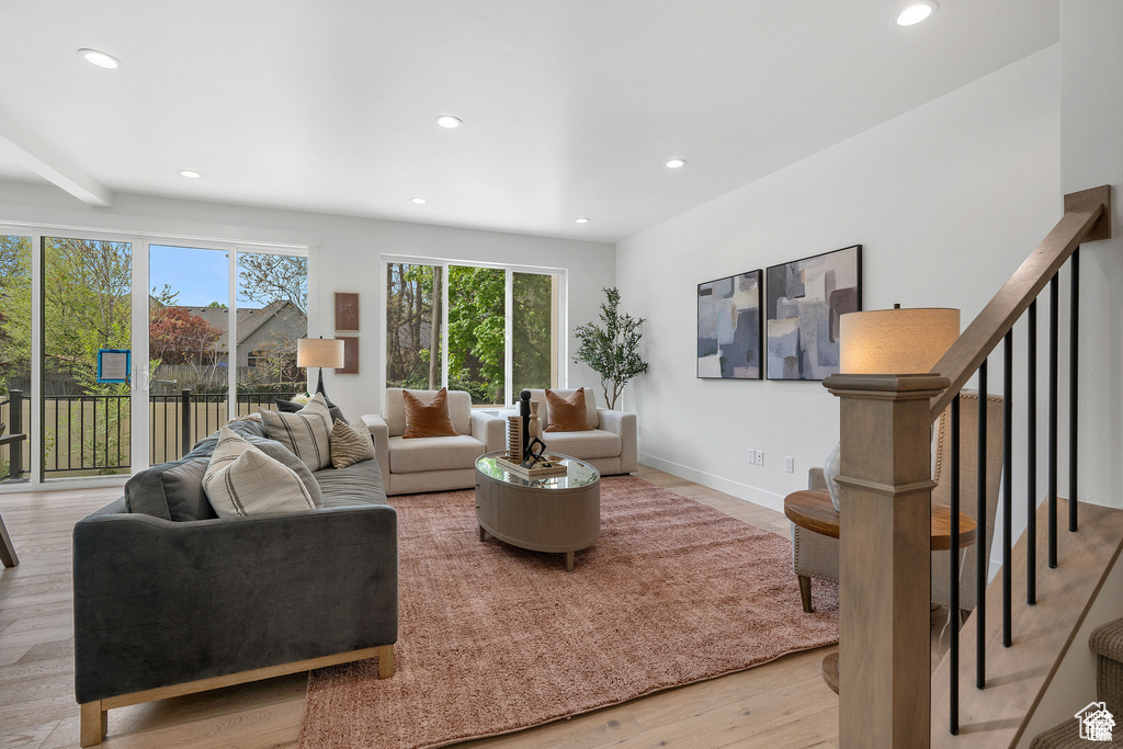 Living room featuring recessed lighting, light wood-type flooring, and baseboards