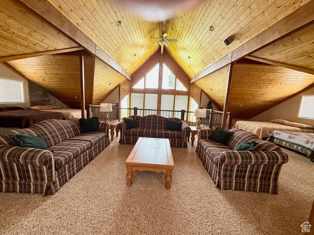 Living room with carpet floors, wood ceiling, and ceiling fan