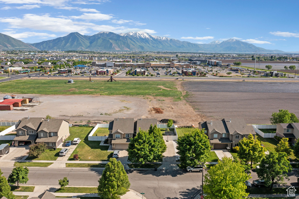 Aerial view of residential area featuring a mountain backdrop