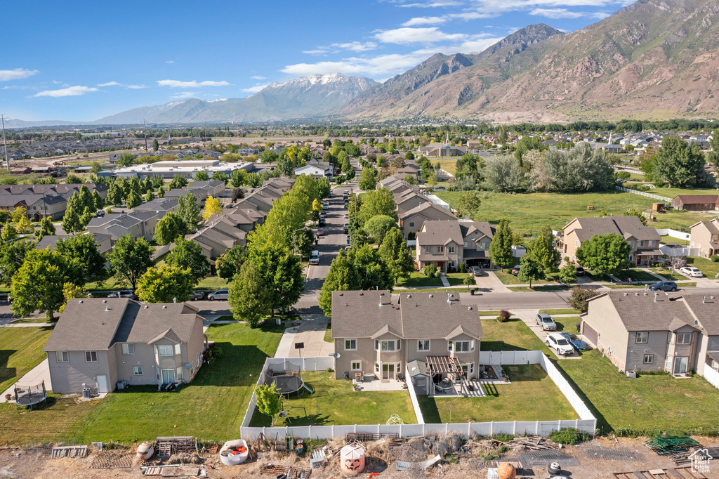 Aerial perspective of suburban area featuring a mountainous background