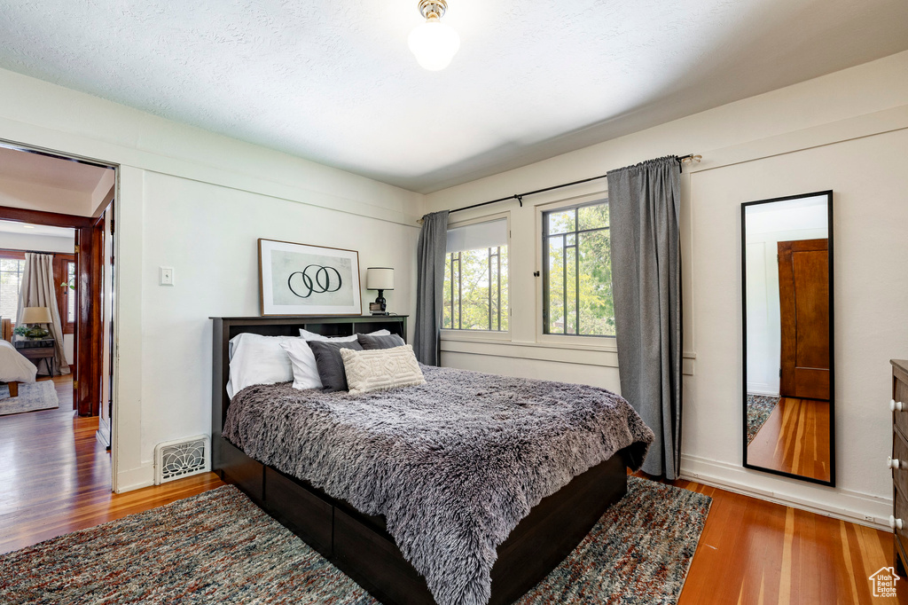 Bedroom with wood finished floors