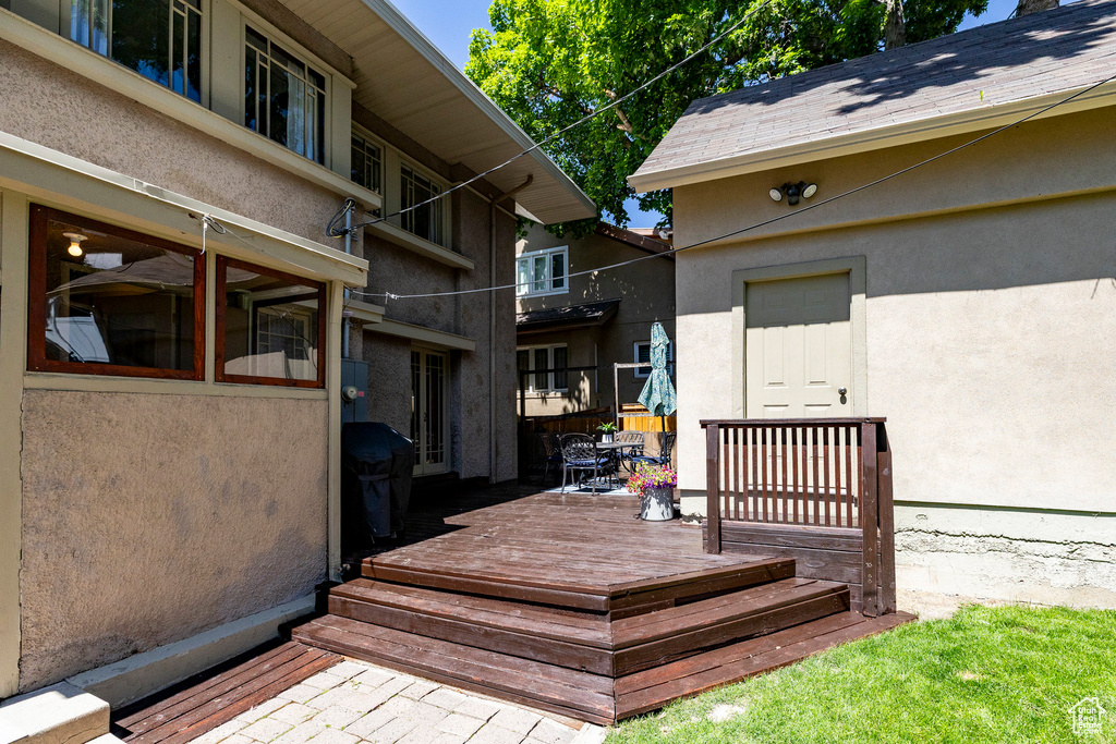 Wooden terrace featuring grilling area