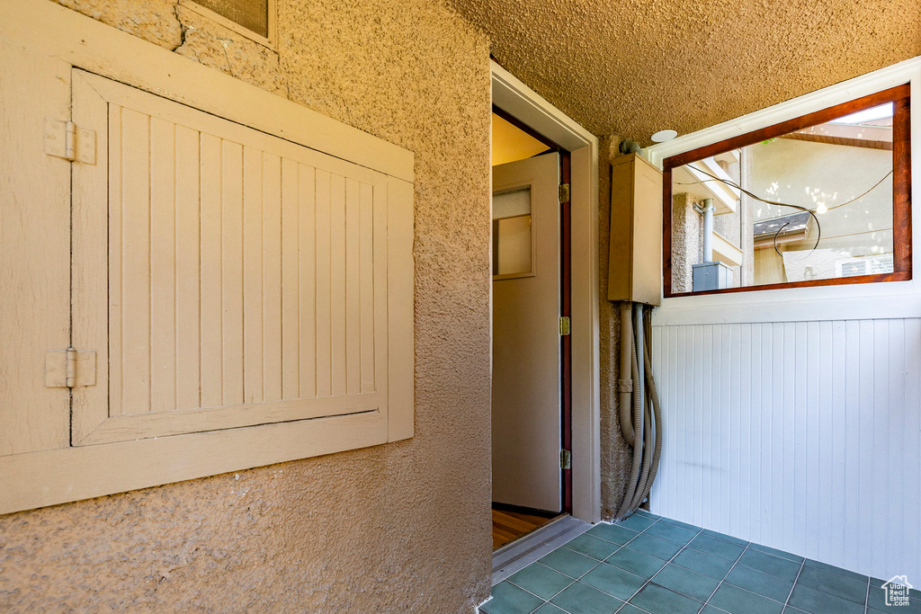 Property entrance with stucco siding