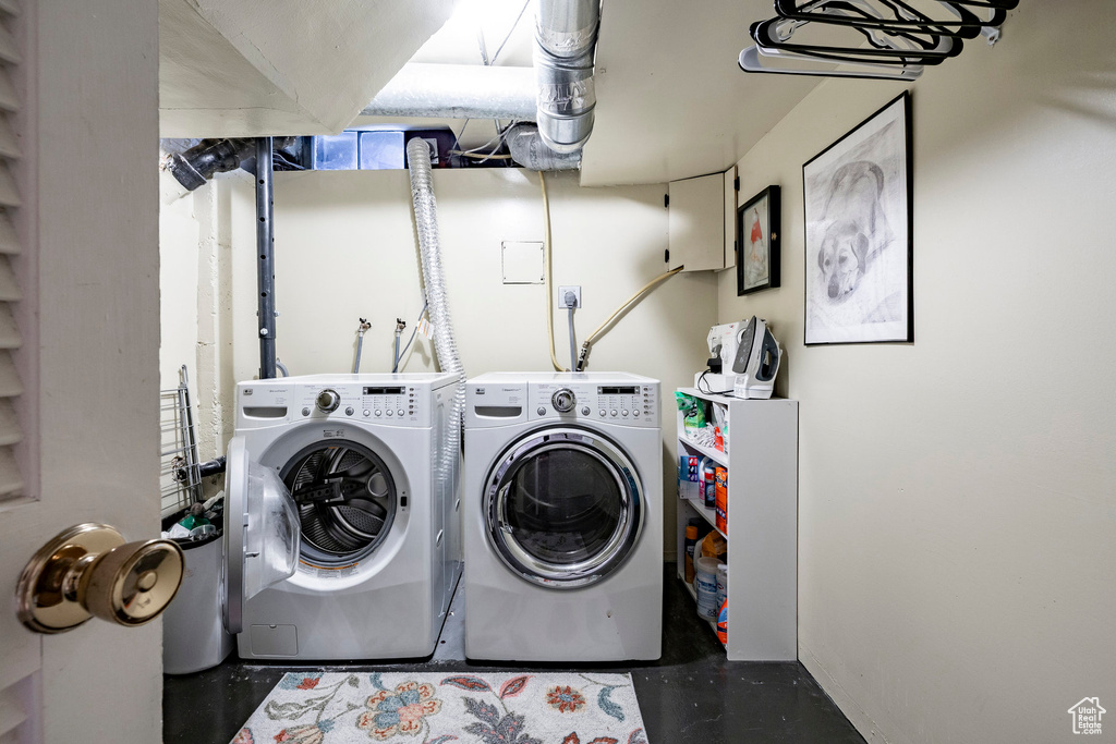 Washroom featuring independent washer and dryer