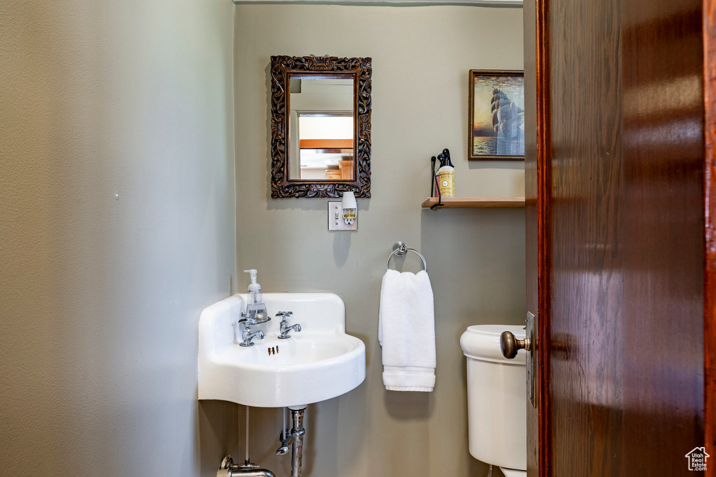 Bathroom featuring toilet and a sink