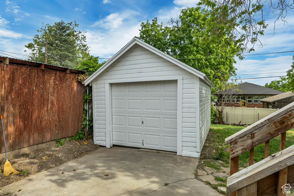 Detached garage with concrete driveway