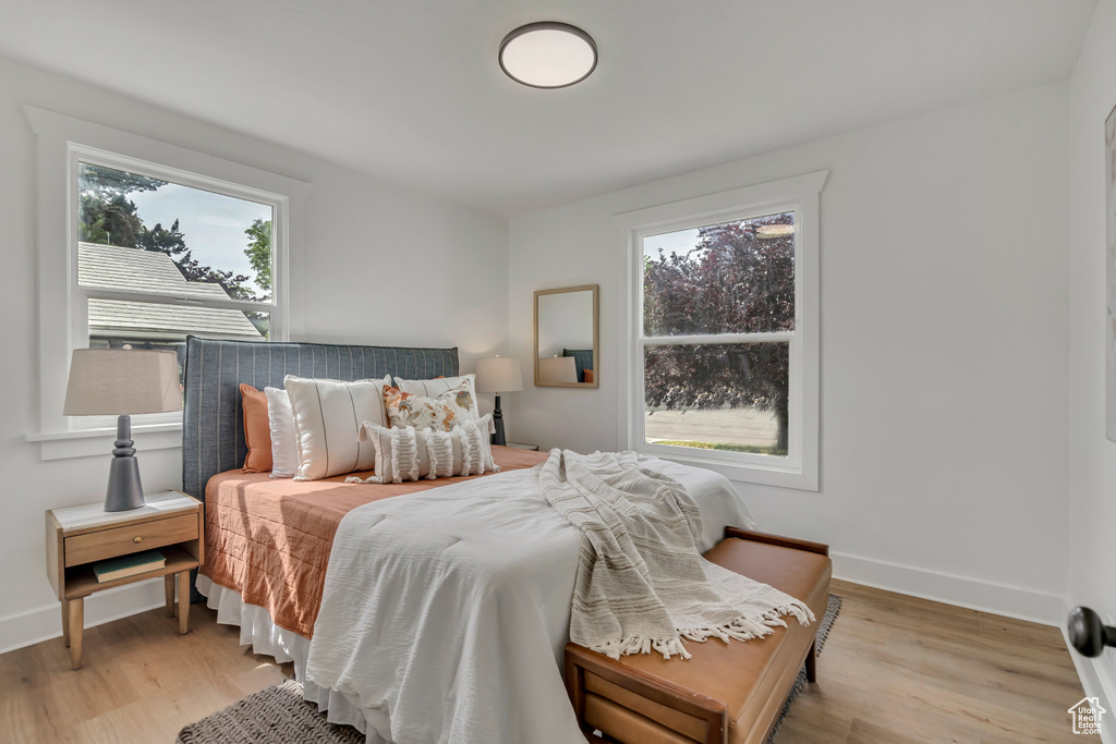 Bedroom featuring light wood finished floors and baseboards