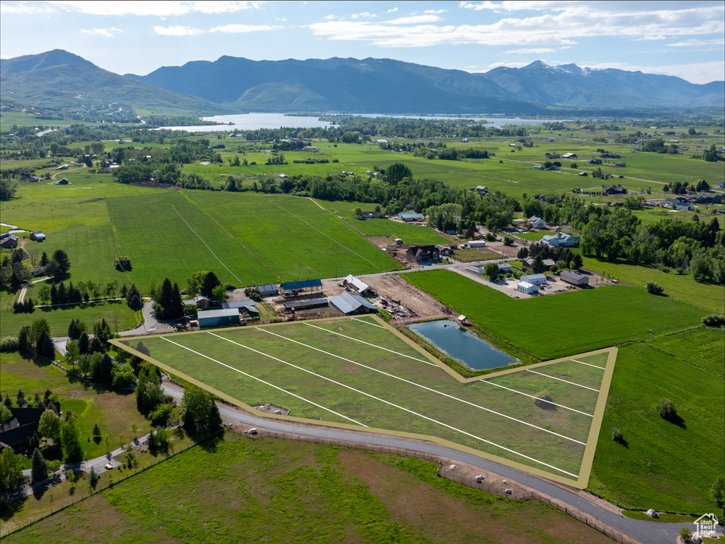 Aerial view of sparsely populated area with a water and mountain view