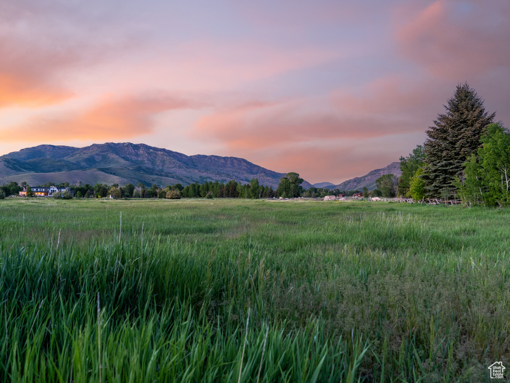 View of mountain backdrop featuring rural landscape
