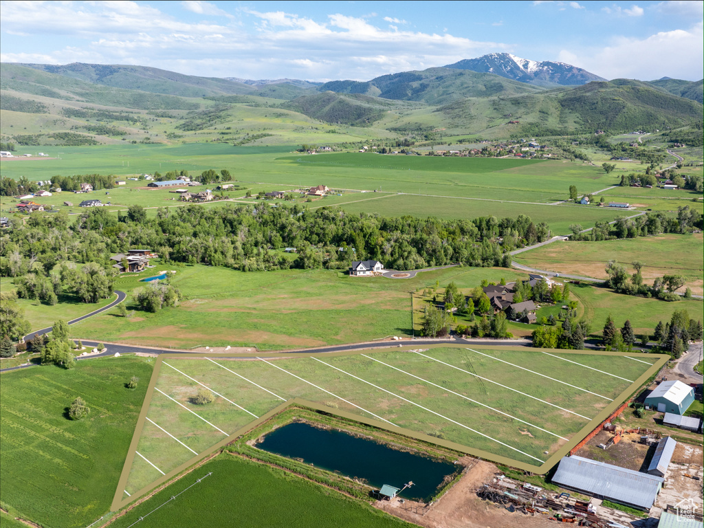 Aerial view of sparsely populated area featuring a mountain backdrop