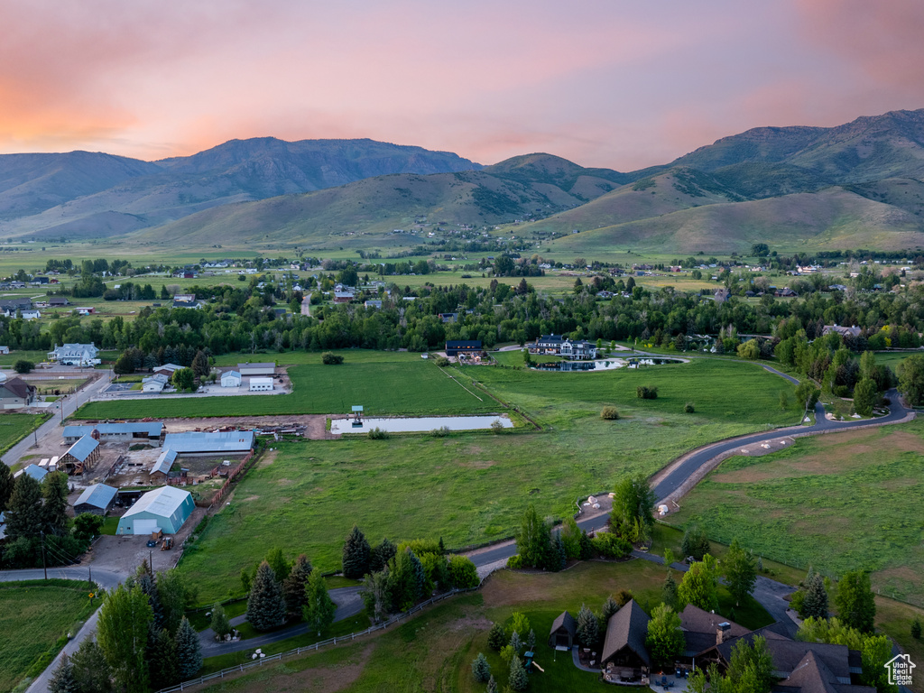 Aerial view of property\'s location featuring a mountainous background